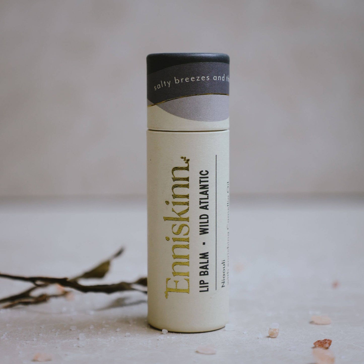 A stick of Enniskinn lip balm with the text 'LIP BALM - WILD ATLANTIC' and the brand's logo on the front.