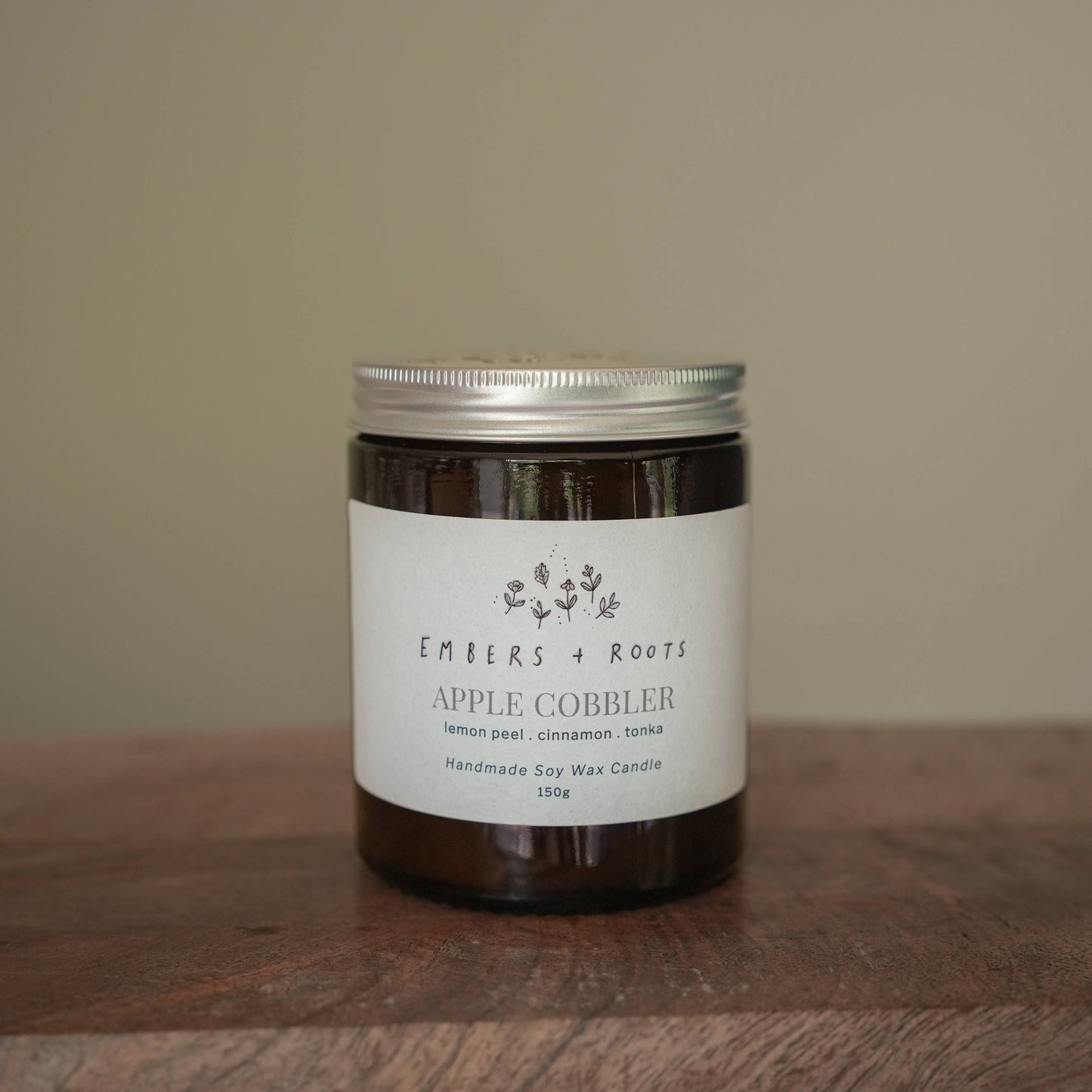 Apple Cobbler scented vegan candle in a glass jar with lid.