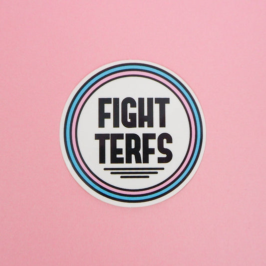 A vinyl sticker with a circular design featuring the text 'FIGHT TERFS' in bold letters