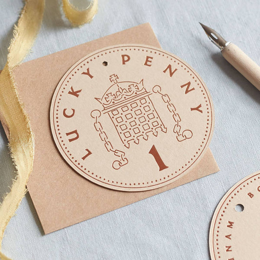 Round 'Lucky Penny' card and envelope on white background
