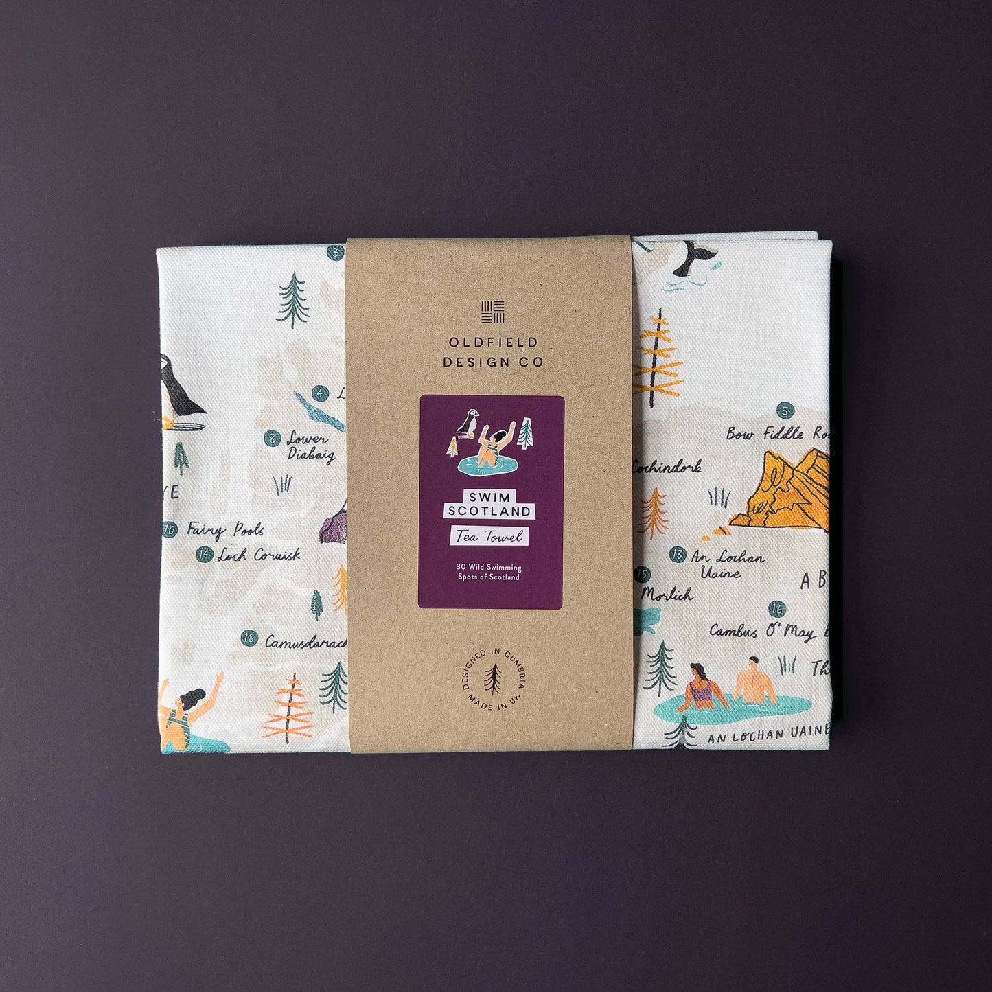 Packaged tea towel with Oldfield Design Co branding on a purple background