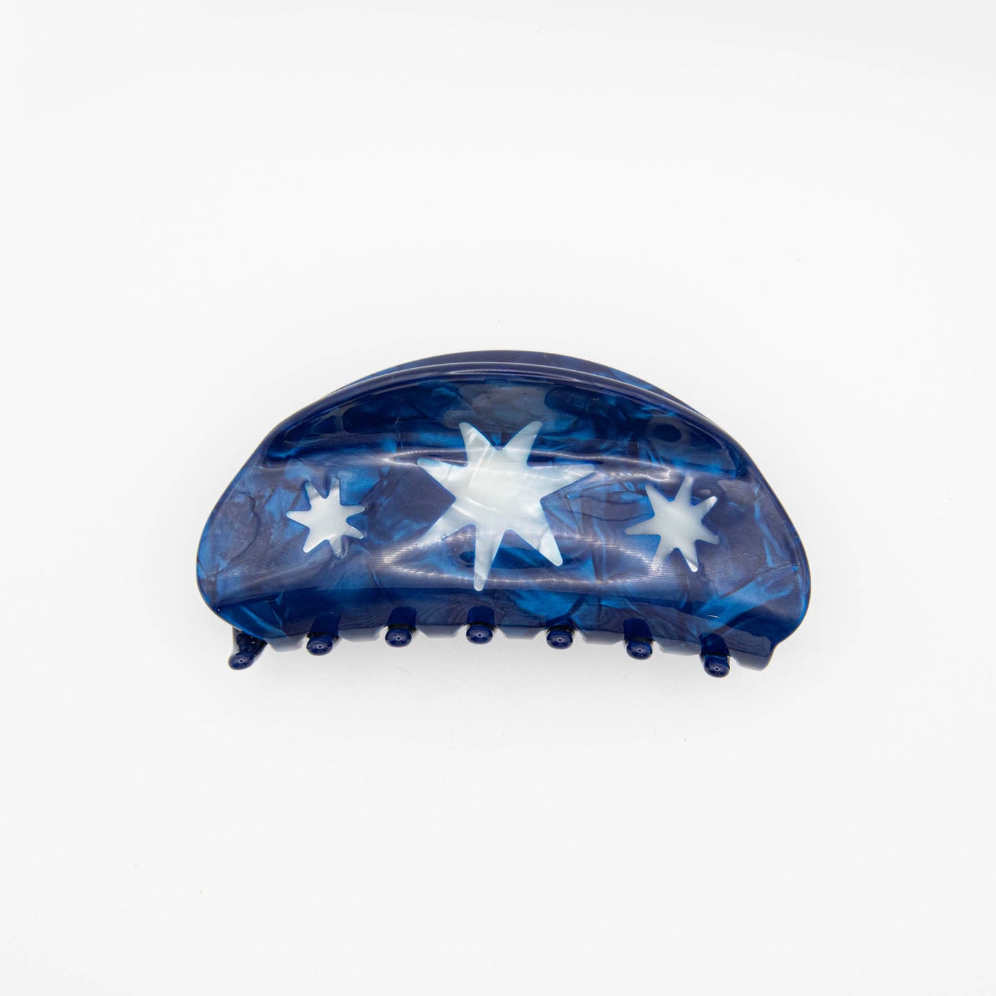 Blue hair clip with star designs on a white background