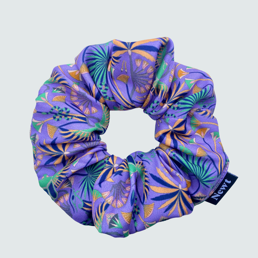 Purple scrunchie with pattern on a light gray background