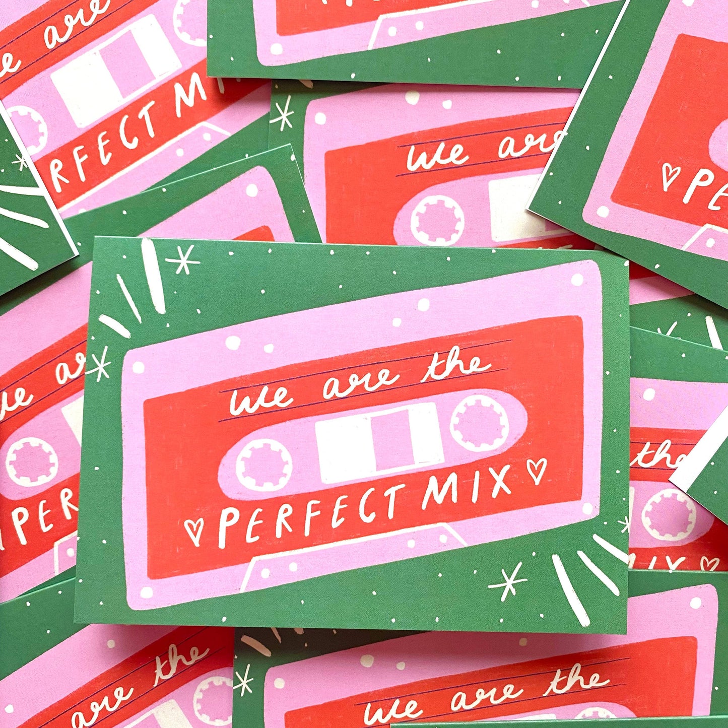 A collection of greetings cards with a retro mix tape design, featuring the text 'We're The Perfect Mix' and decorated with stars and hearts.