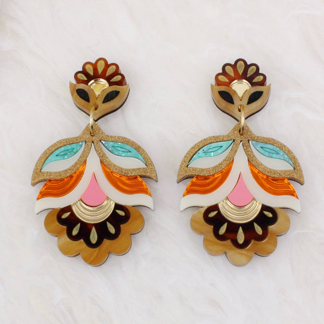 Pair of colorful earrings on a white background