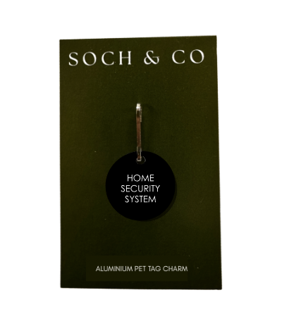 Black pet tag charm with 'Home Security System' text on a Soch & Co card.