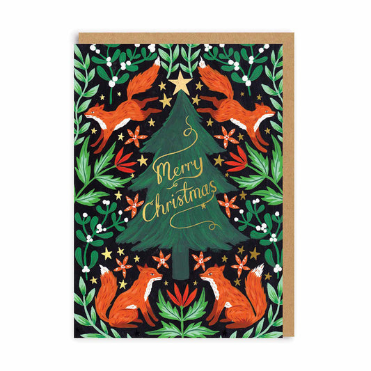 A beautifully illustrated greeting card of foxes and foliage surrounding a christmas tree in the centre with gold foil stars and lettering that reads ' Merry Christmas'
