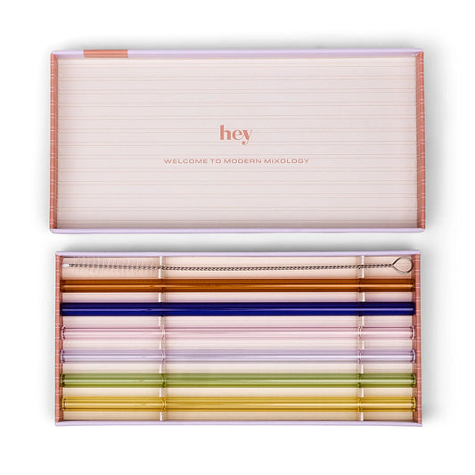 Set of colorful straws in a 'hey' branded box on a white background
