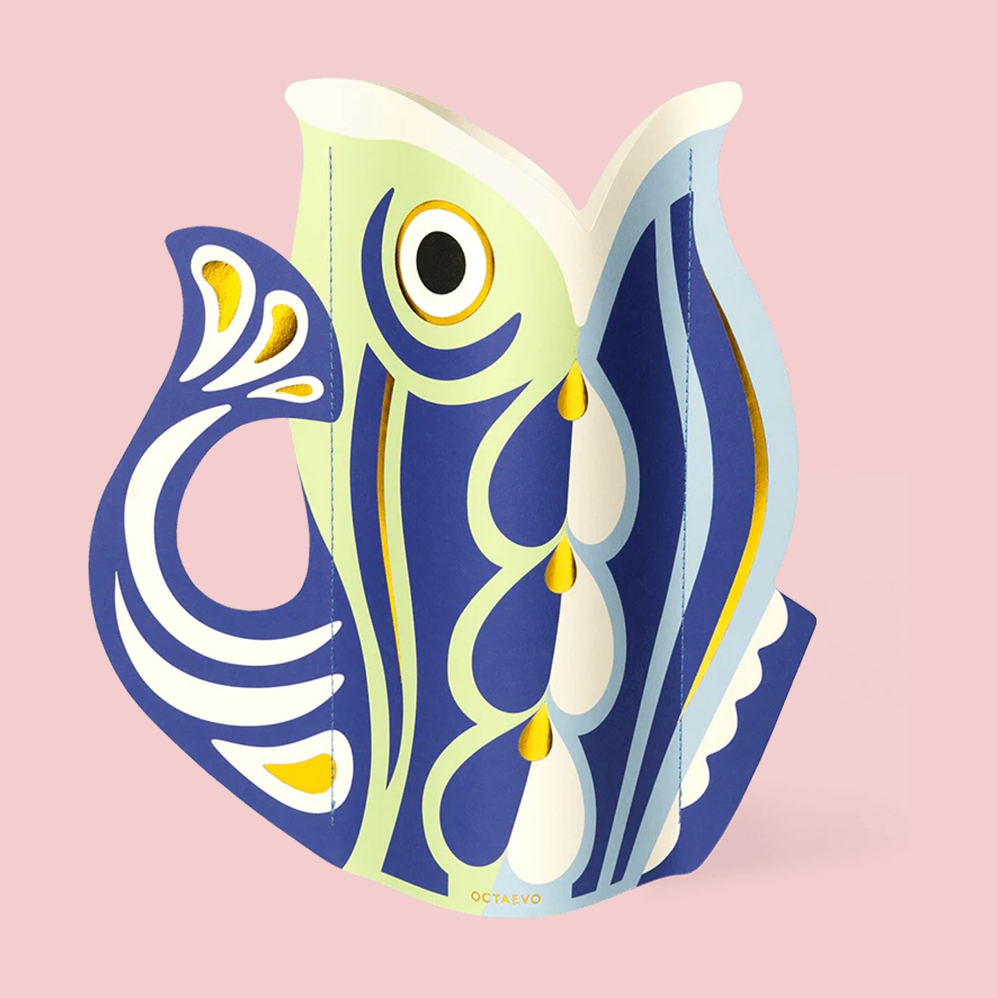 Decorative fish-shaped paper vase  with blue, white, and gold patterns on a pink background