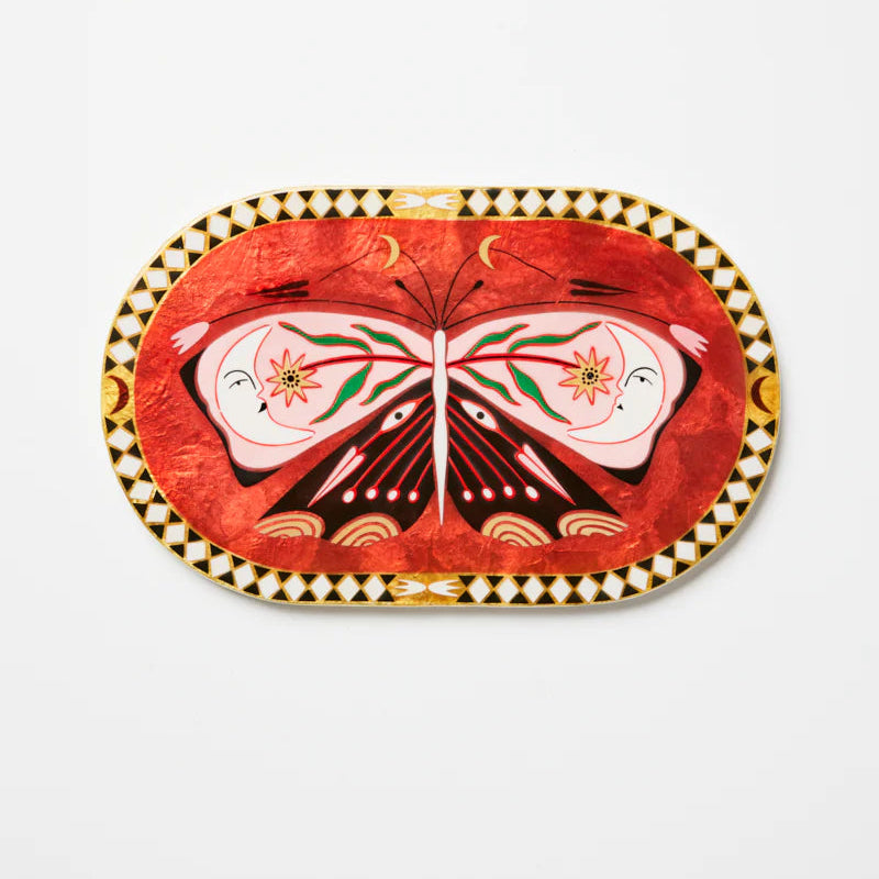 Decorative capiz tile with butterfly design on a white background