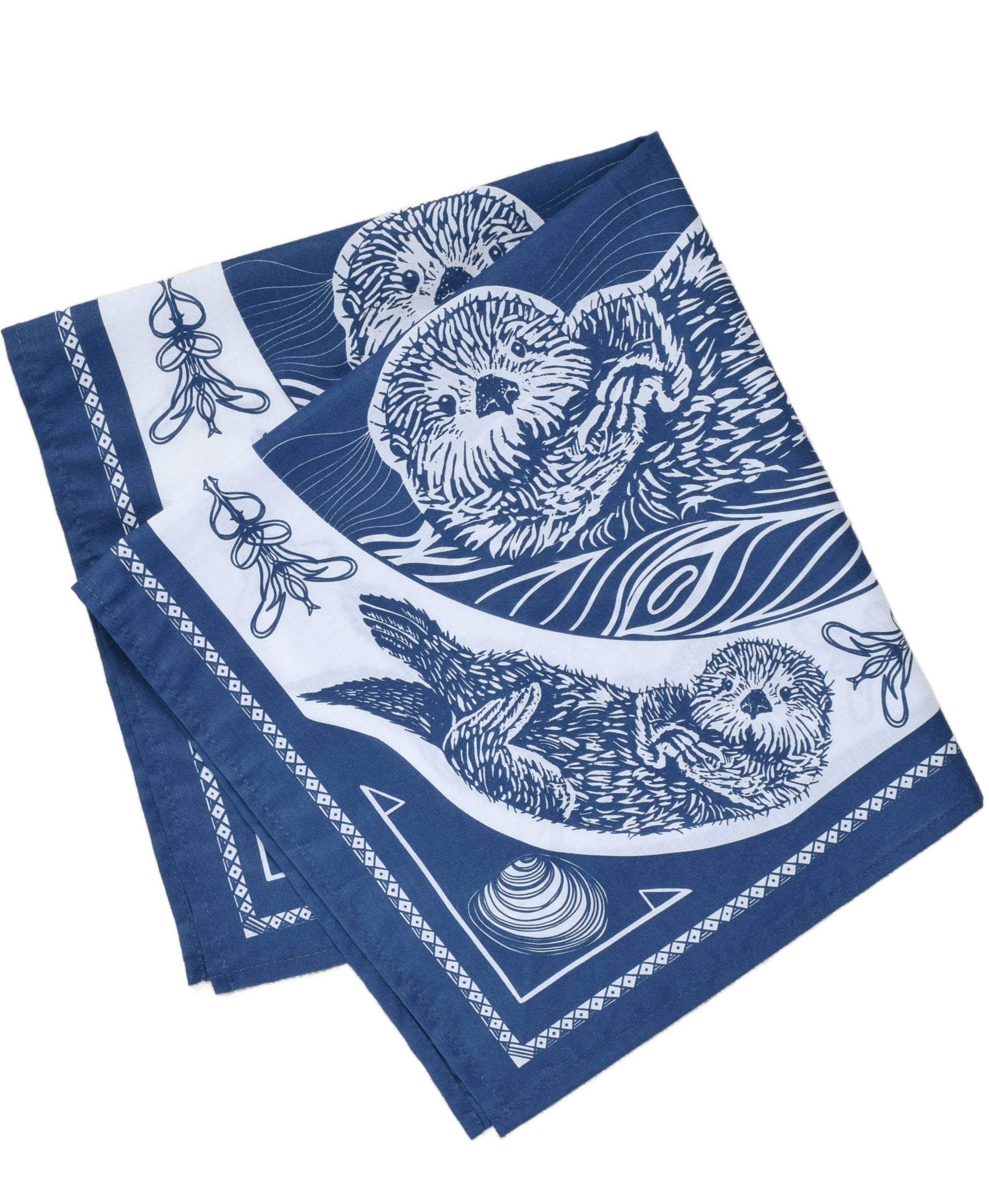 Folded blue bandanas with white otter designs on a white background