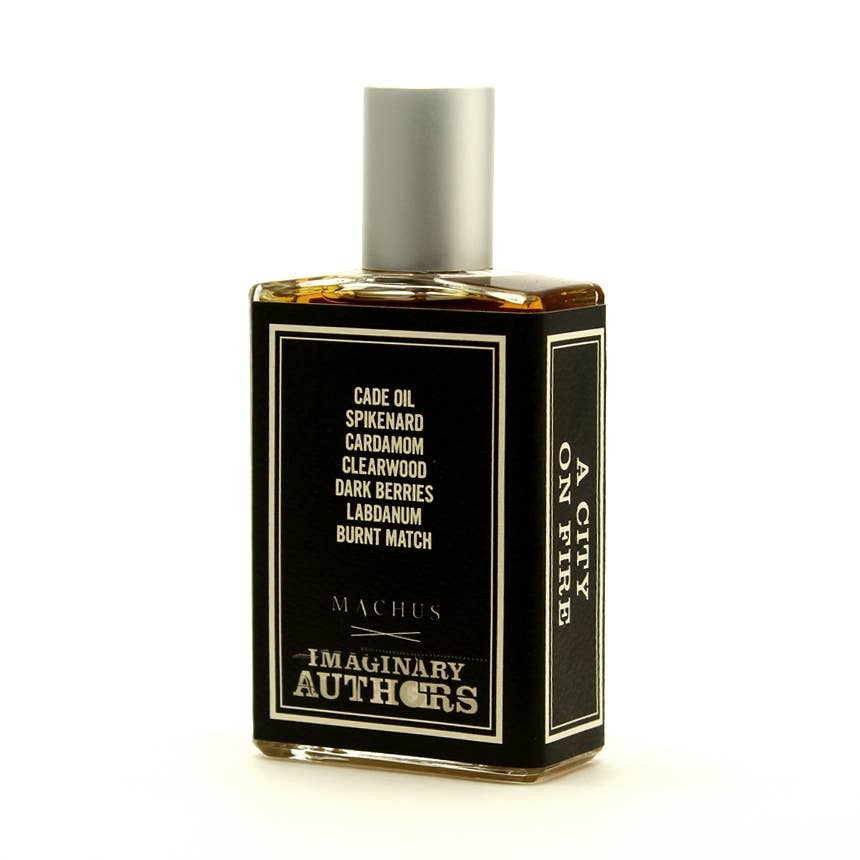 Perfume bottle with black label on a white background