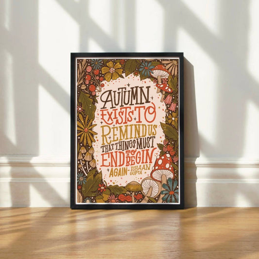 Framed autumn-themed print with decorative autumnal elements.