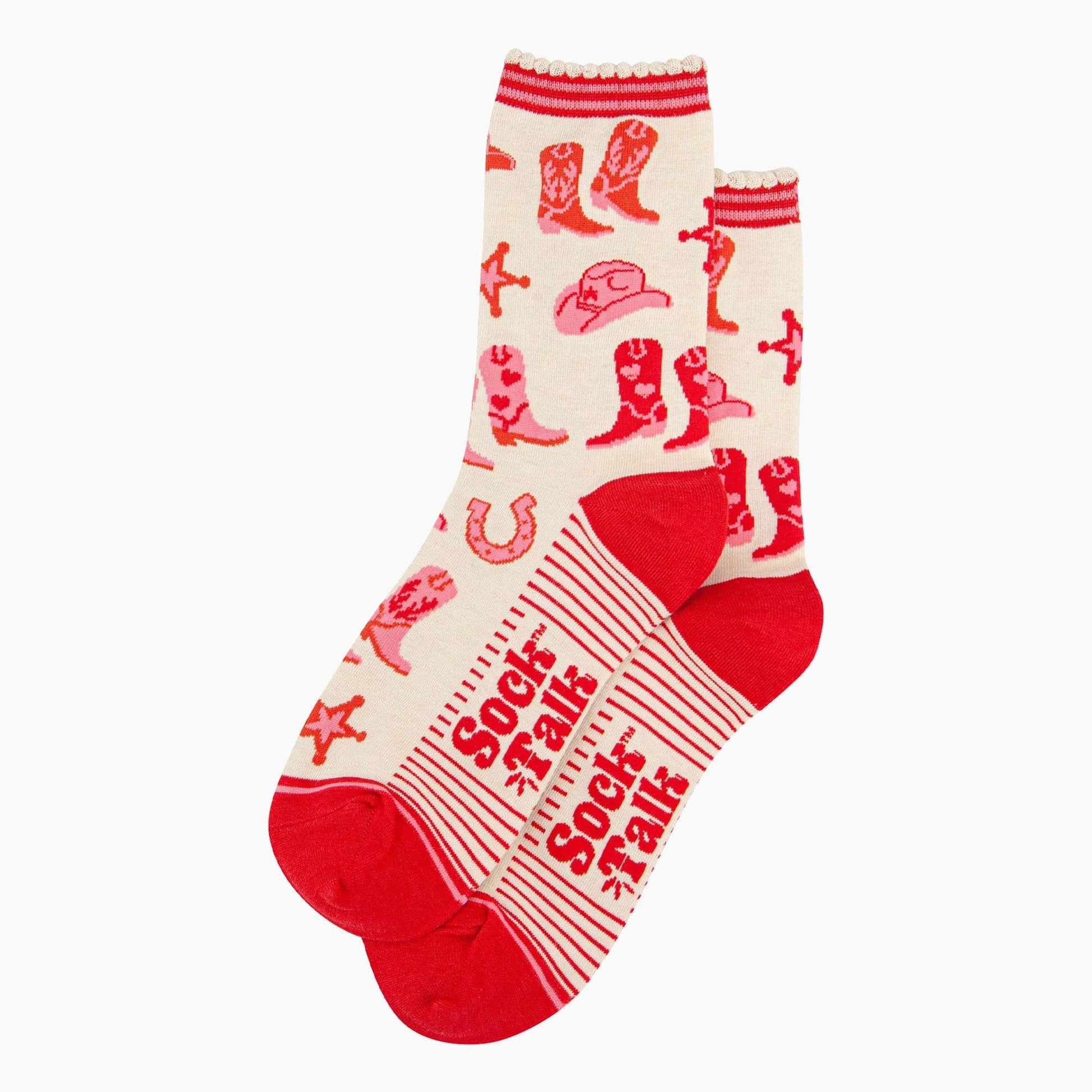 A pair of ankle socks with a western cowgirl theme, featuring red boots and accessories on a cream background with red stripes at the heel. Lying flat on a white background.