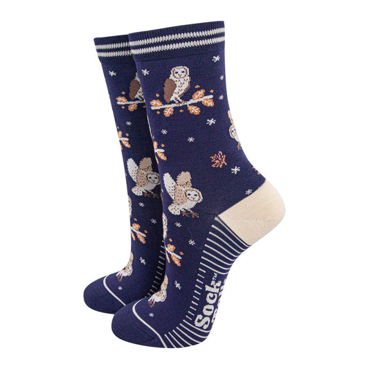 Navy blue socks with owl pattern on a white background