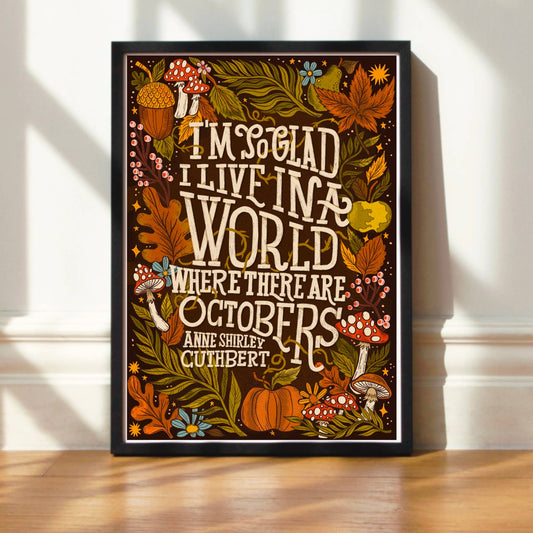 Decorative print with autumn-themed design and text on a wall.