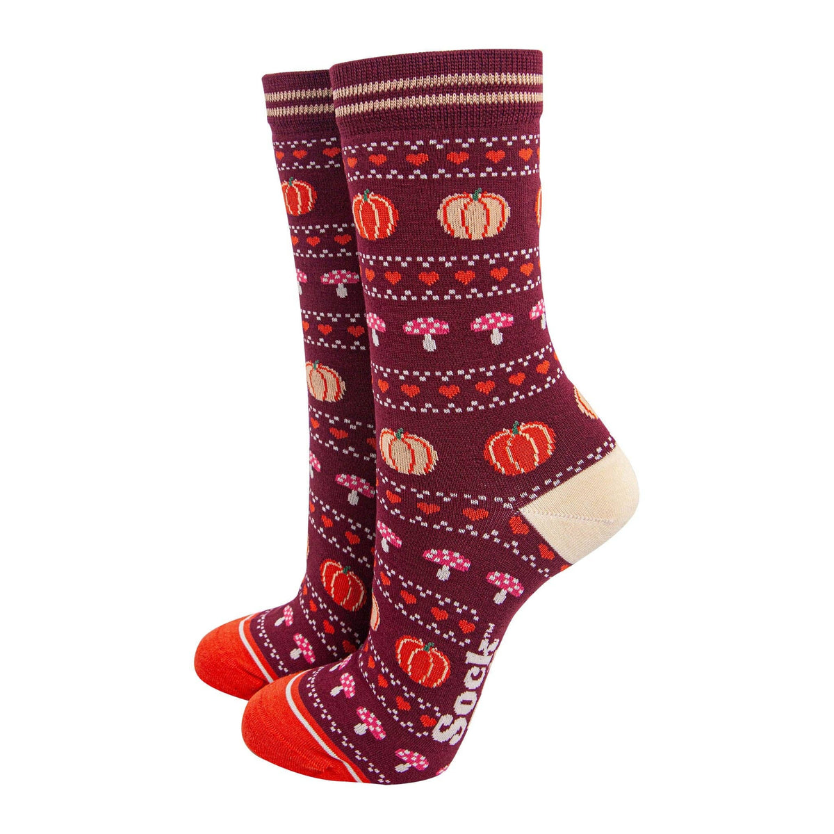 Pair of socks with autumn-themed pattern on a burgundy background