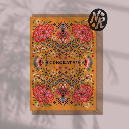 Decorative greeting card with floral design and 'Congrats!' text on an orange floral background.