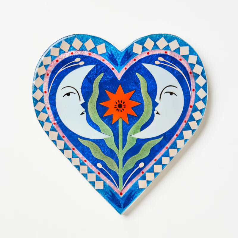 Decorative heart-shaped capiz tile with two moons and a flower illustration