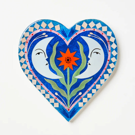 Decorative heart-shaped capiz tile with two moons and a flower illustration