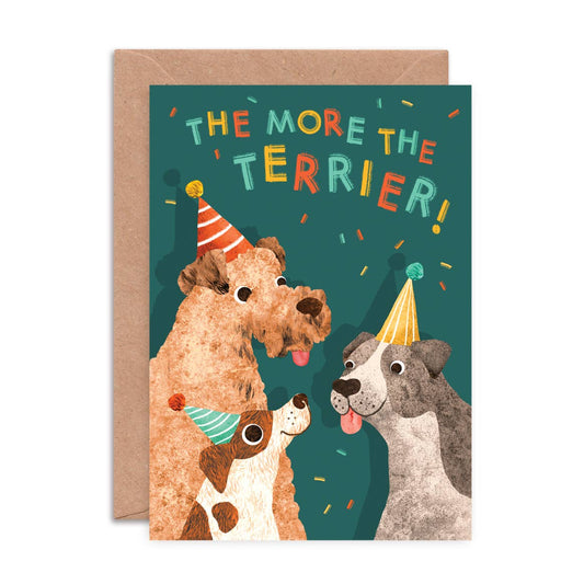 Greeting card with three dogs wearing party hats and 'The More the Terrier!' text on a green background.