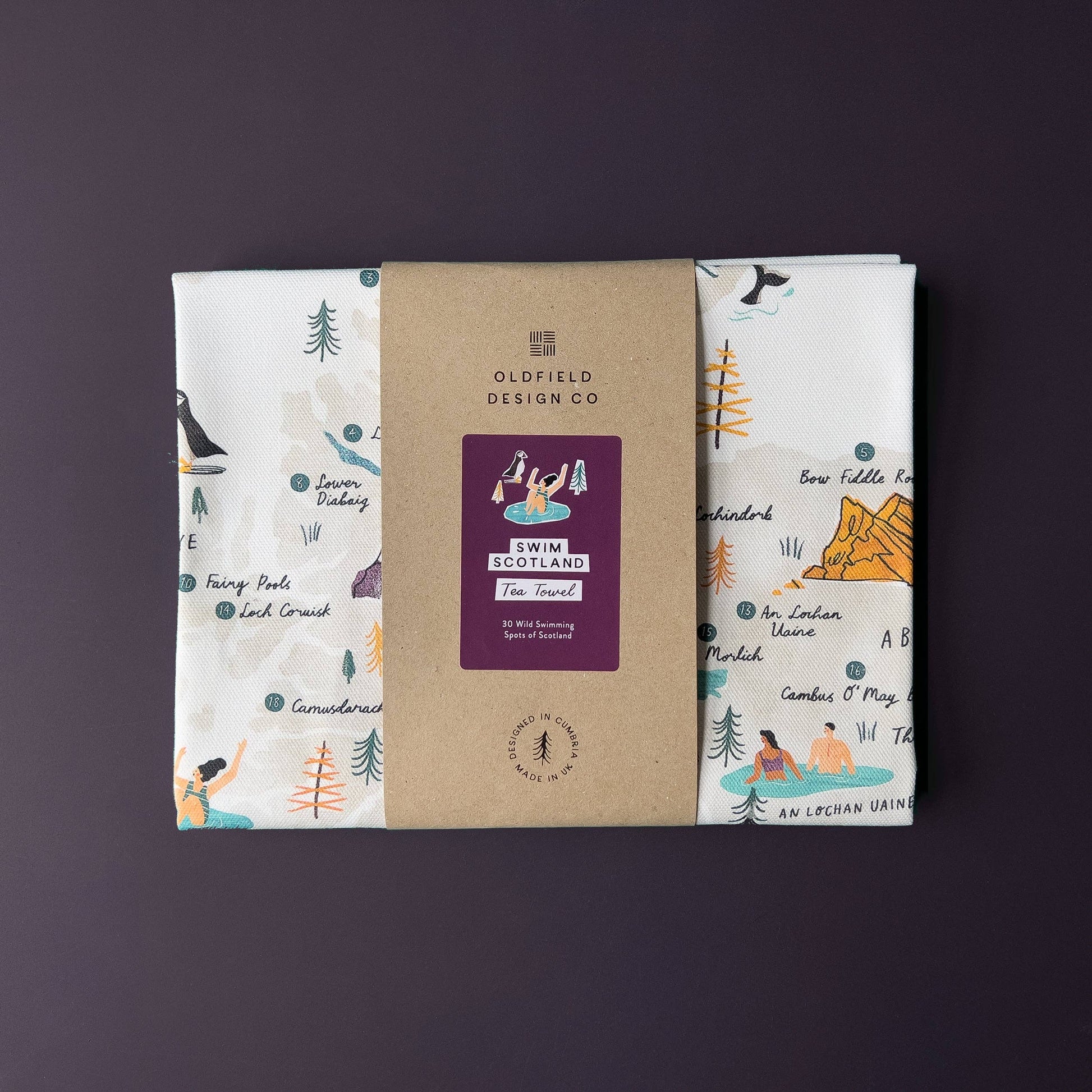 Packaged tea towel with Oldfield Design Co branding on a purple background