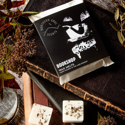 Bookshop wax melts packaging on an old book with decorative elements