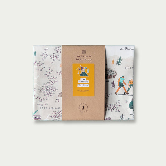 Packaged product with a brown label and scenic design on a white background