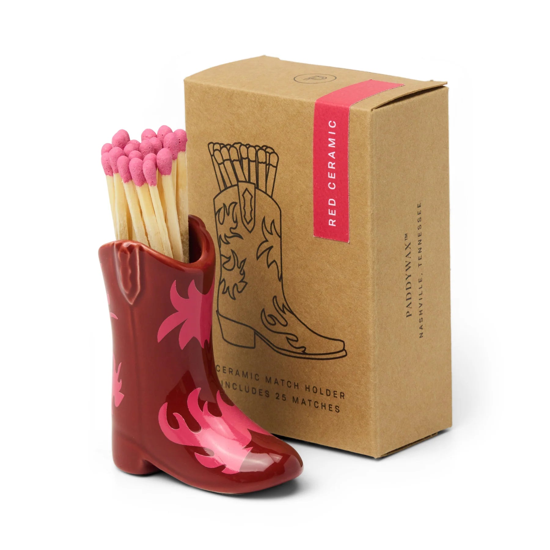 Retro style cowboy boot match holder in red and pink with it's packaging box behind it