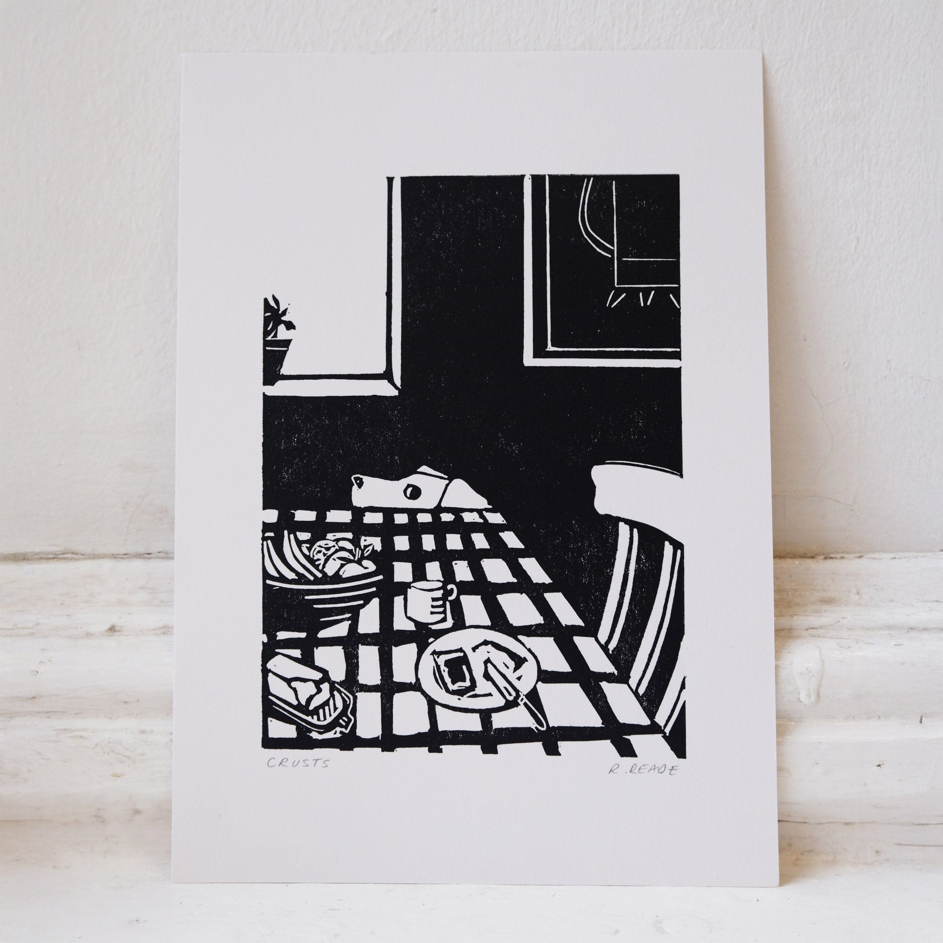 Black and white illustration of a table setting on with a dog eying up some leftovers