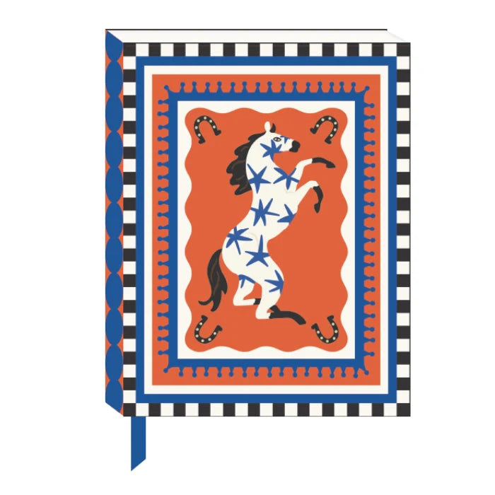 a patterned journal cover in red white and blue with a leaping horse pattern.