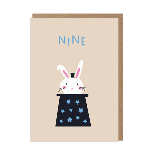A greeting card with an illustration of a white rabbit in a magician's hat, wearing a blue and black outfit with stars, and the number '9' on the top.