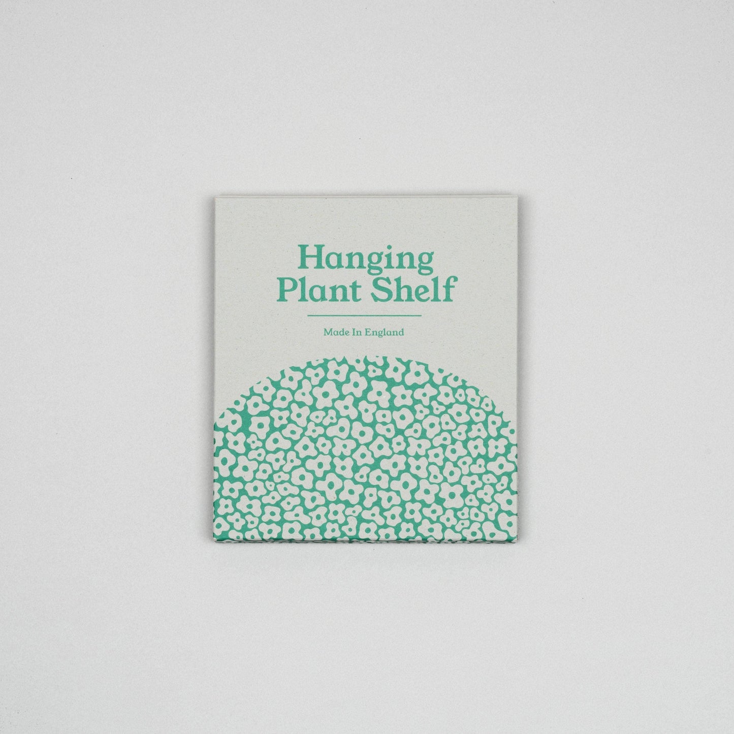 Hanging plant shelf pattern with green floral pattern on a gray background