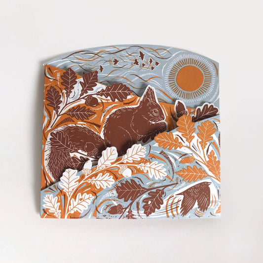 A concertina card featuring a red squirrel design
