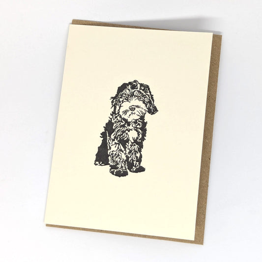 A greeting card with a black and white print of a Cockapoo dog.