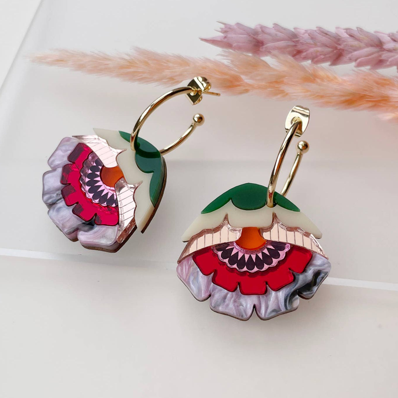 Floral earrings on a light background