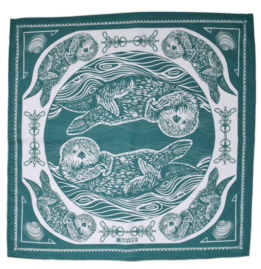 Teal bandana with white otter illustrations and patterns on a white background