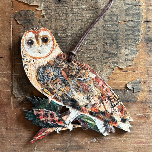 Illustration of an owl printed on wooden ornament