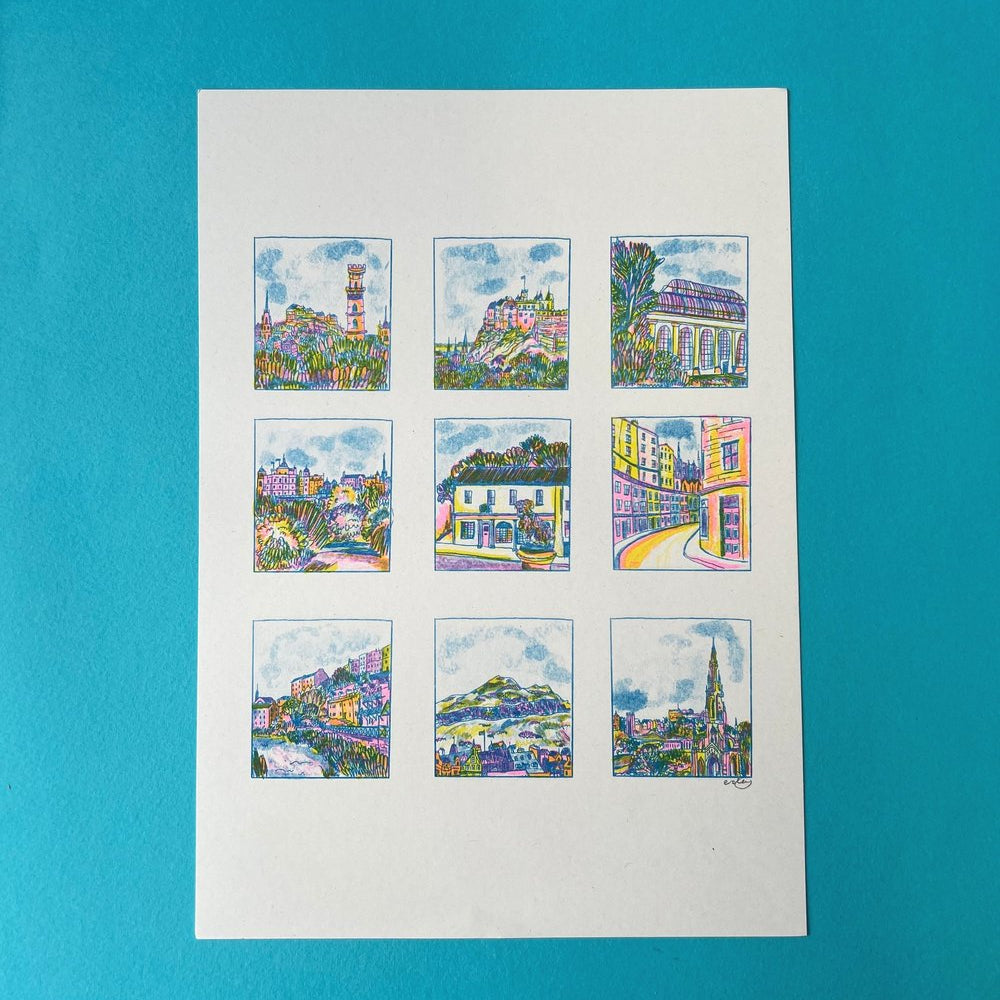 Colorful mini artworks arranged in a grid on white paper against a blue background.