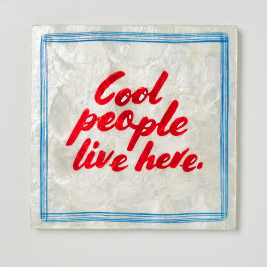 Capiz shell tile with 'Cool people live here' text .