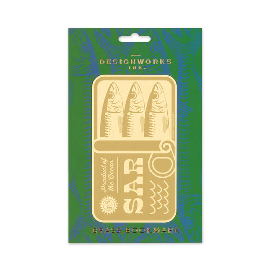 Brass bookmark with fish design on green and blue patterned packaging